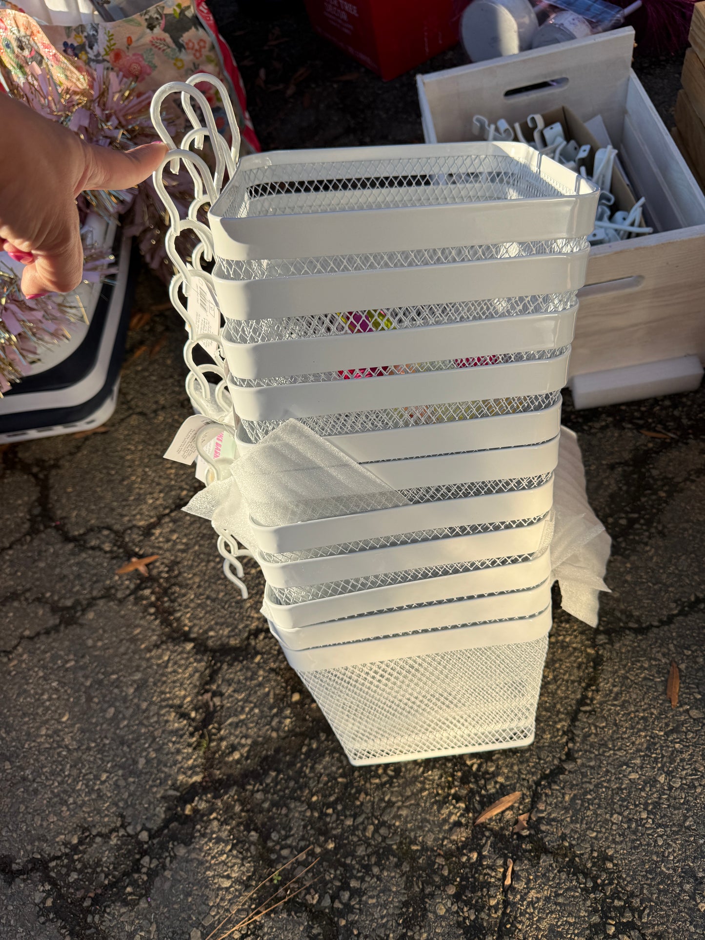 Hanging white metal baskets